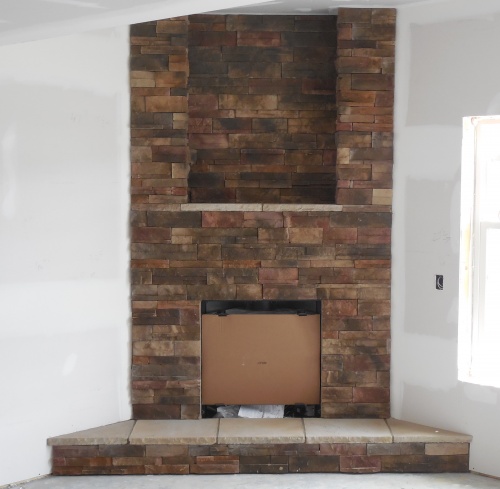 Brick corner fireplace - new home construction