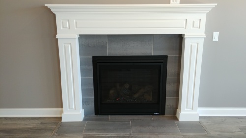 New home construction - White framed fireplace