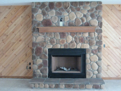 Stone Fireplace with wood mantle
