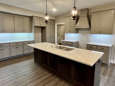 Dramatic Kitchen Lighting in a Capstone Home