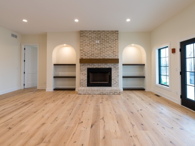Fireplace with shelves on either side