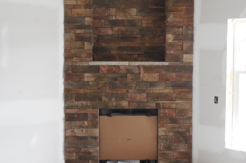 Brick corner fireplace - new home construction
