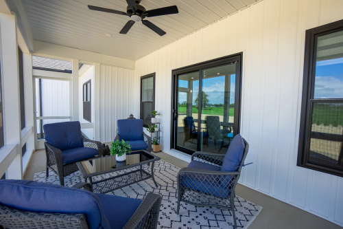 Capstone Custom Homes back patio with three season room